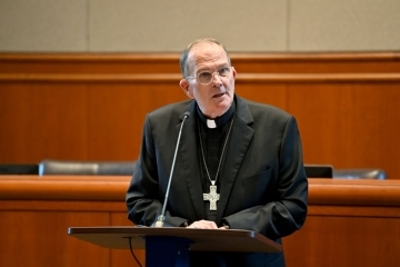 Most Reverend David M. O’Connell, C.M., J.C.D., D.D. speaking at podium