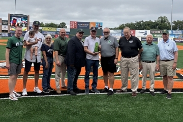 James Lally and Whitey Ford's family on baseball field