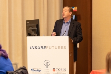 Man speaking at the podium 