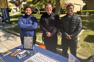 St. John's Catholic staff, congregations and a student