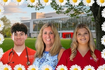 Students in scrubs next to faculty member