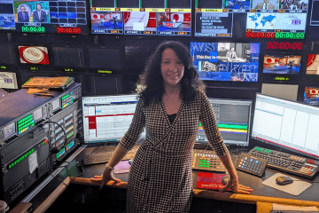Women in front of computer monitors room