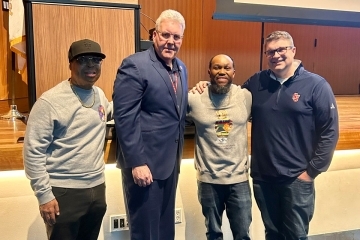 A group of men posing for a photo