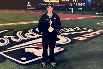 St. john's alumna on met's stadium field