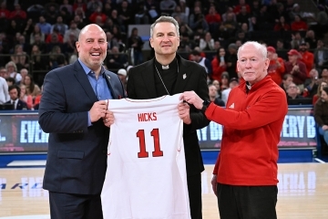 Ed Kull, Archbishop Hicks and Fr. Shanley on MSG court
