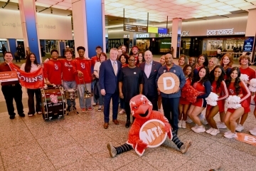 Red Storm fans celebrating in subway station