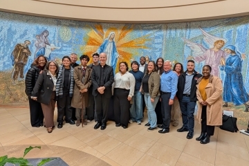 Fr. James Martin poses with St. John's attendants from his lecture