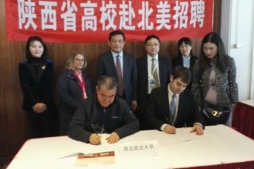 Carl Olson Sign NWUPL Teaching Contract