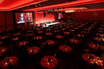 Dinner in Ballroom with speakers on screen at podium