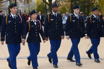 5 students dressed in ROTC uniform walking