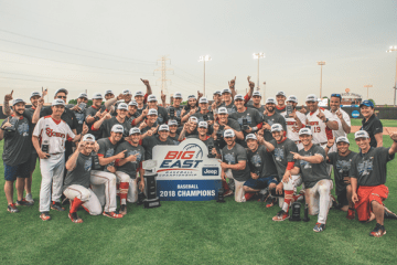 BIG EAST Baseball Team holding sign after BIG EAST win