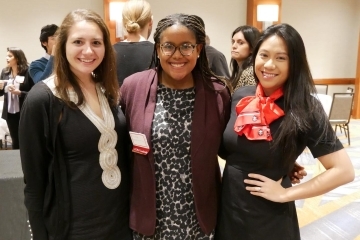 three woman looking straight at the camera