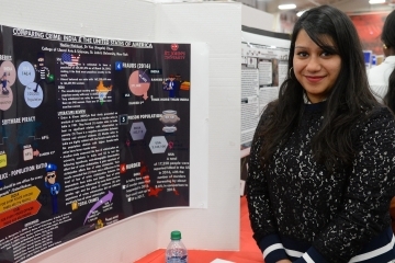 female student infront of her presentation