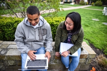 St. John's Student's Studying near the Great Lawn on the Queens campus