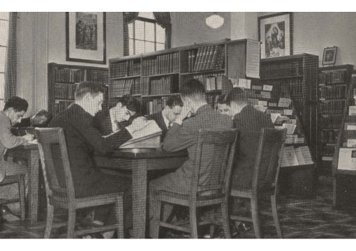 Students from 1880 sitting at table studying