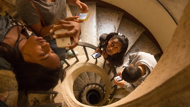 Students walking up winding stairs