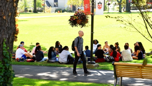 Students sitting on the great lawn