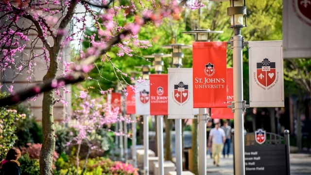 Row of red and white flag banners on St. John's University Campus 