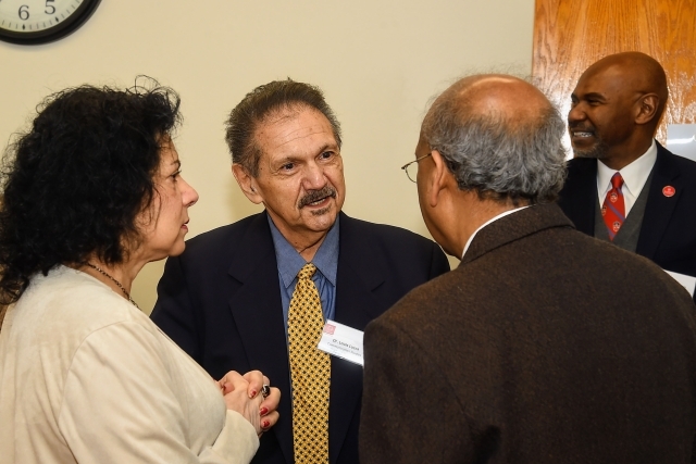 Administrators talking to one another at articulation agreement signing