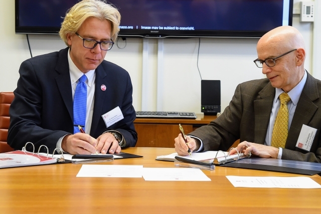Simon Moller and Paul Arcario Signing Papers 