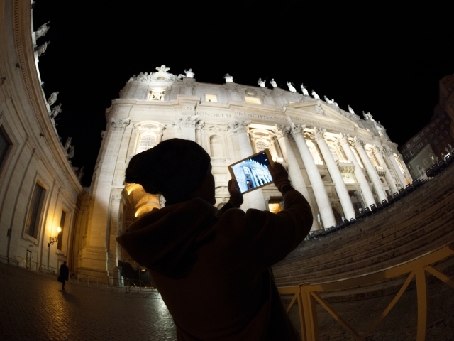Student Taking Picture in Rome at Night