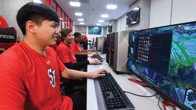 Student playing esports on computers 