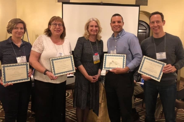 Five faculty members holding awards they recieved