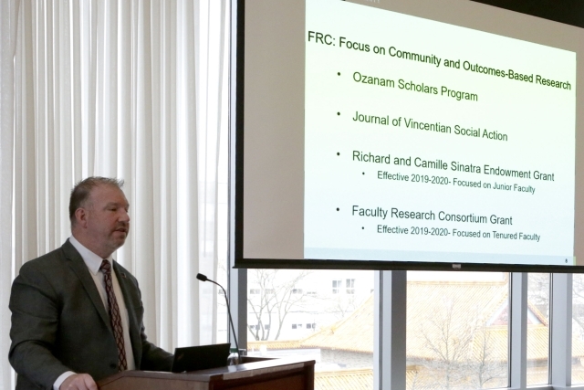 Male speaking at podium