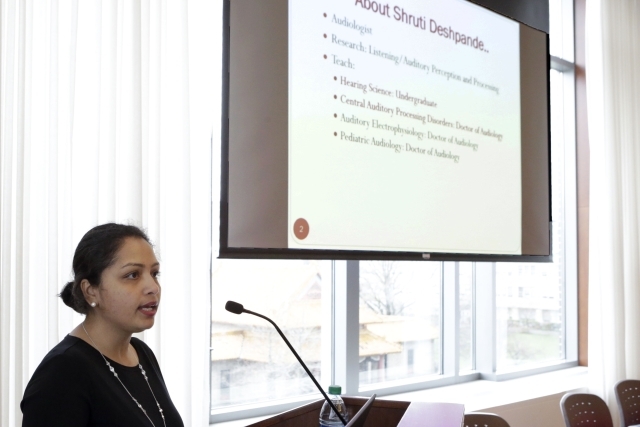 Female speaking at podium