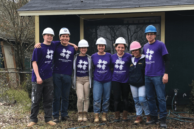 Students pose after successfully completing their tasks during the Houston Plunge.