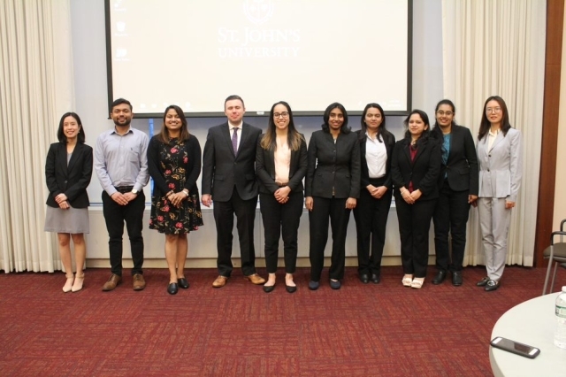 Five Minute Thesis competition students pose for a group picture