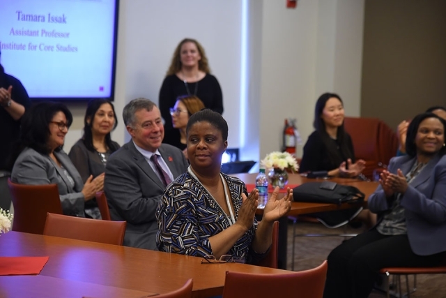 Woman clapping at the VIP reception