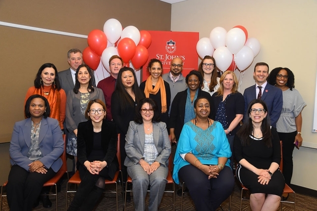 VIP reception attendees pose for a group shot