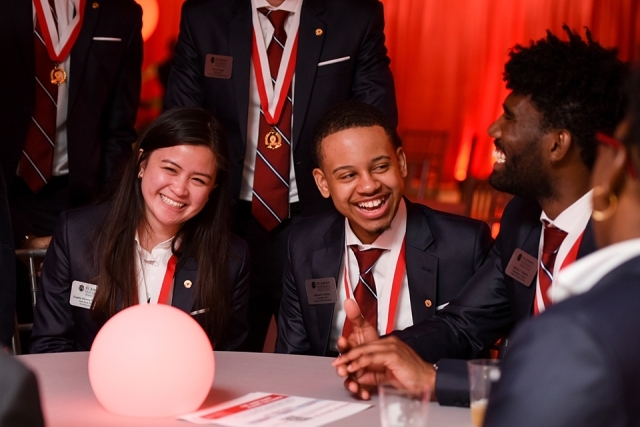 President's Society members sitting at a table