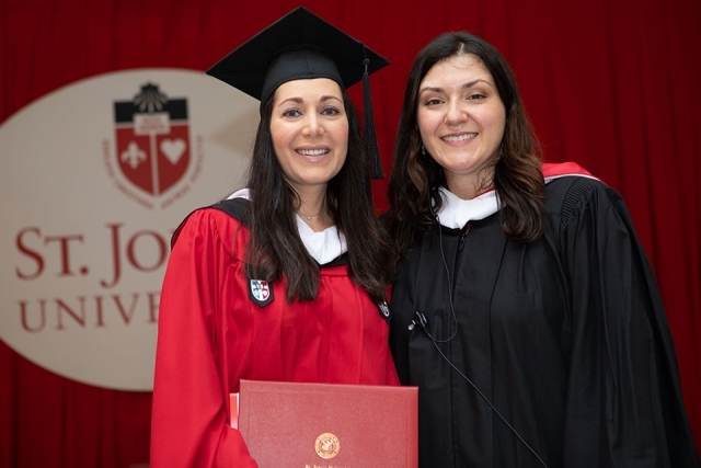 Two females at Rome Commencement