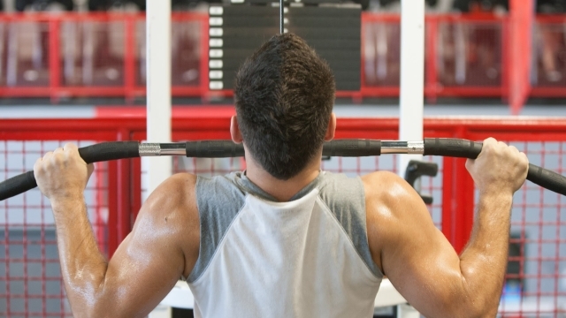 Male lifting weights in fitness center