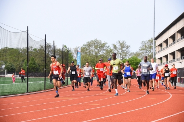 Runners racing on track