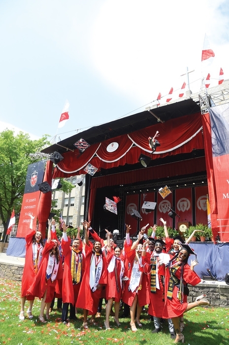 Students posing for photo at Commencement ceremony