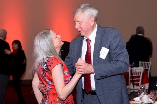Couple dancing under tent