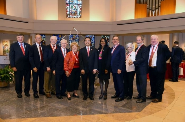 Honorees posing inside St. Thomas More Church