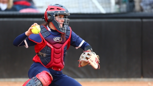 Kaitlin Mattera throwing a ball during a softball game