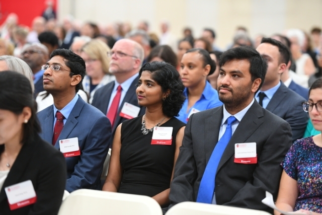 Employees sitting in audience during New Faculty Convocation