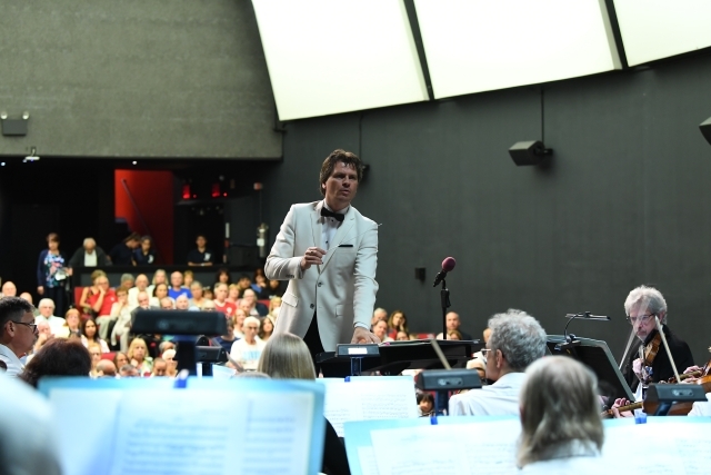 Conductor in front of orchestra