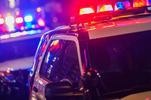 Police cars with sirens on