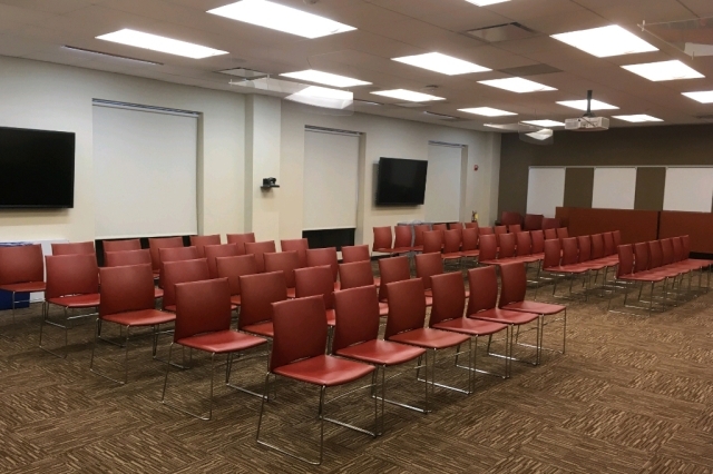 Empty room with chairs setup in rows