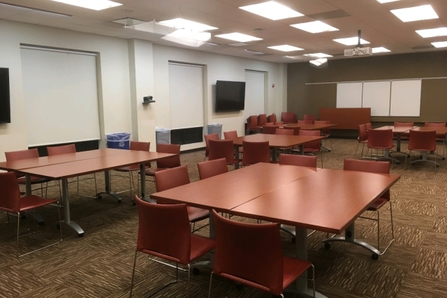 Empty room with chairs and tables setup
