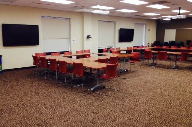 Empty room with chairs and tables setup