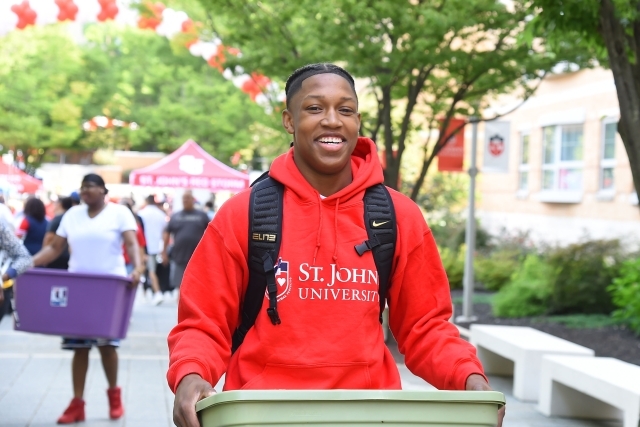 Student Mover carrying a container
