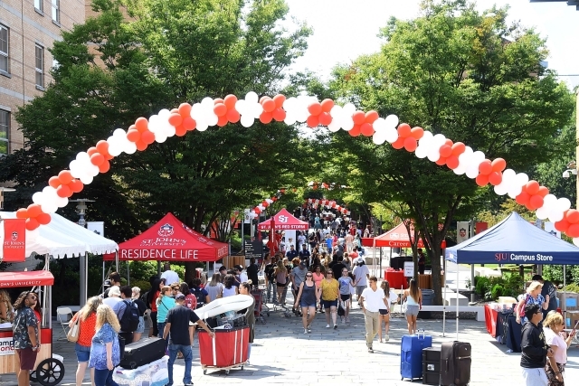 Wide shot of Residence Village with balloon arch