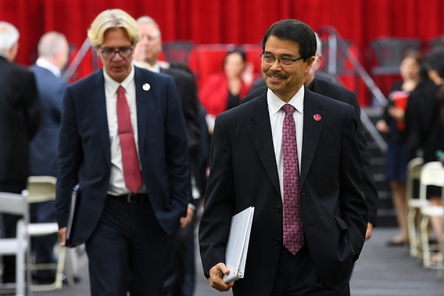 Dr Gempesaw and Dr Moller walking off stage